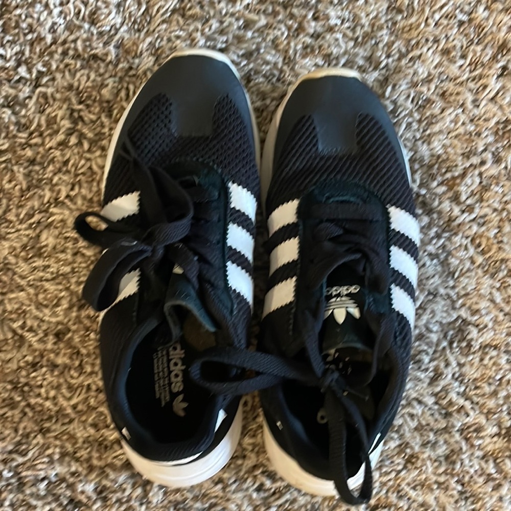 Women’s black adidas tennis shoes